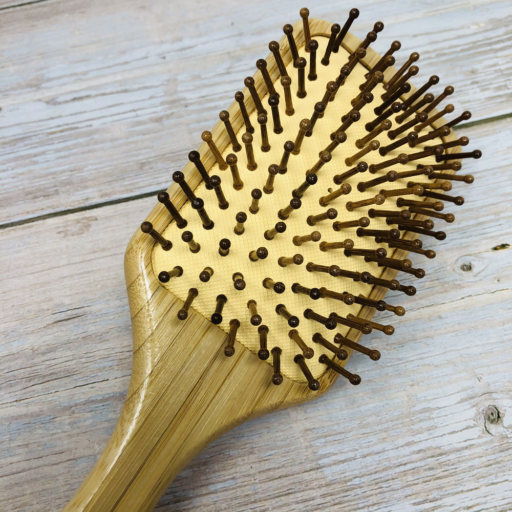 paddle hair brush head with wooden bristles and rubber cushion
