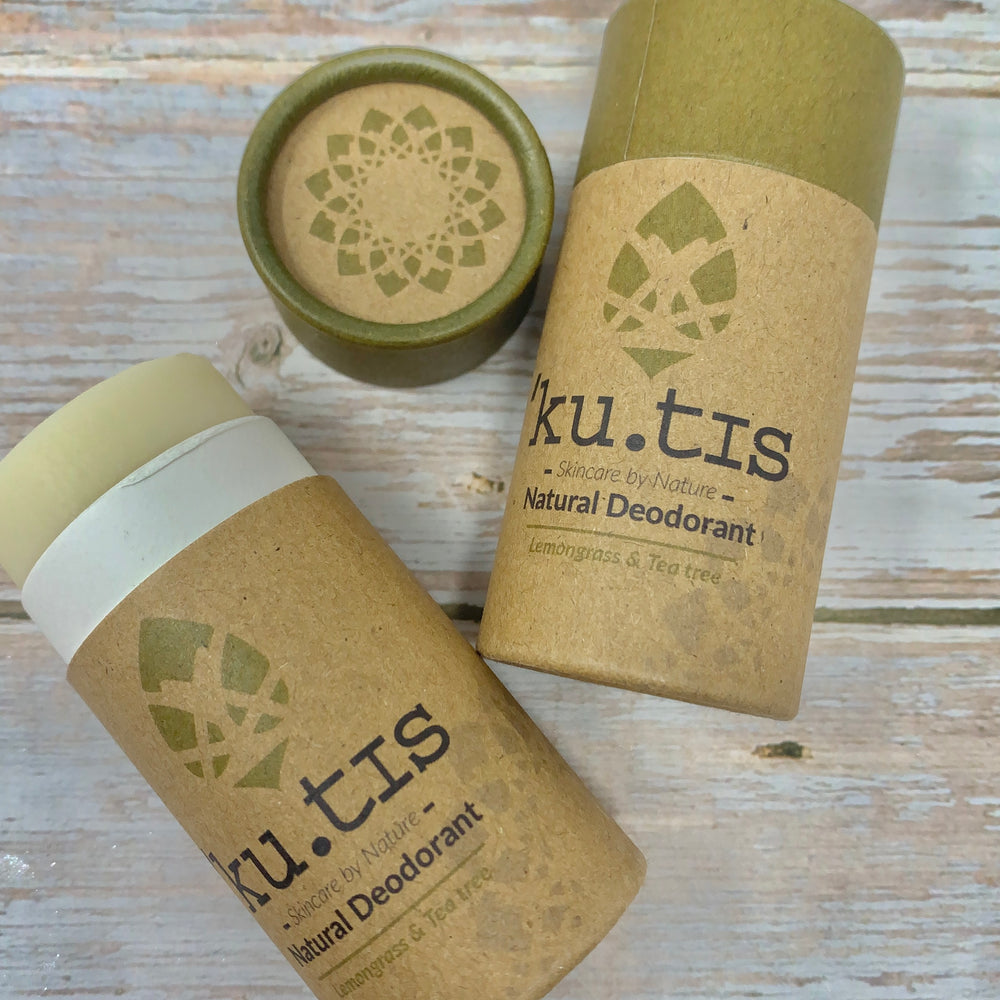 two natural deodorants from kutis with brown cardboard tube and green cap