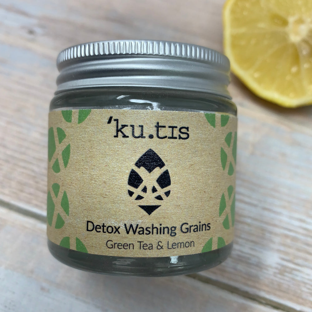 natural face cleanser with green tea and lemon by kutis on wooden background
