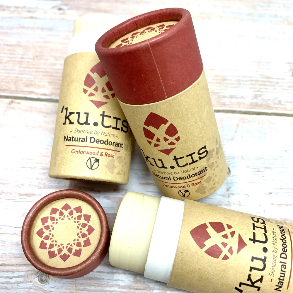 vegan deodorant stick in paper push up tube made with brown and magenta cardboard