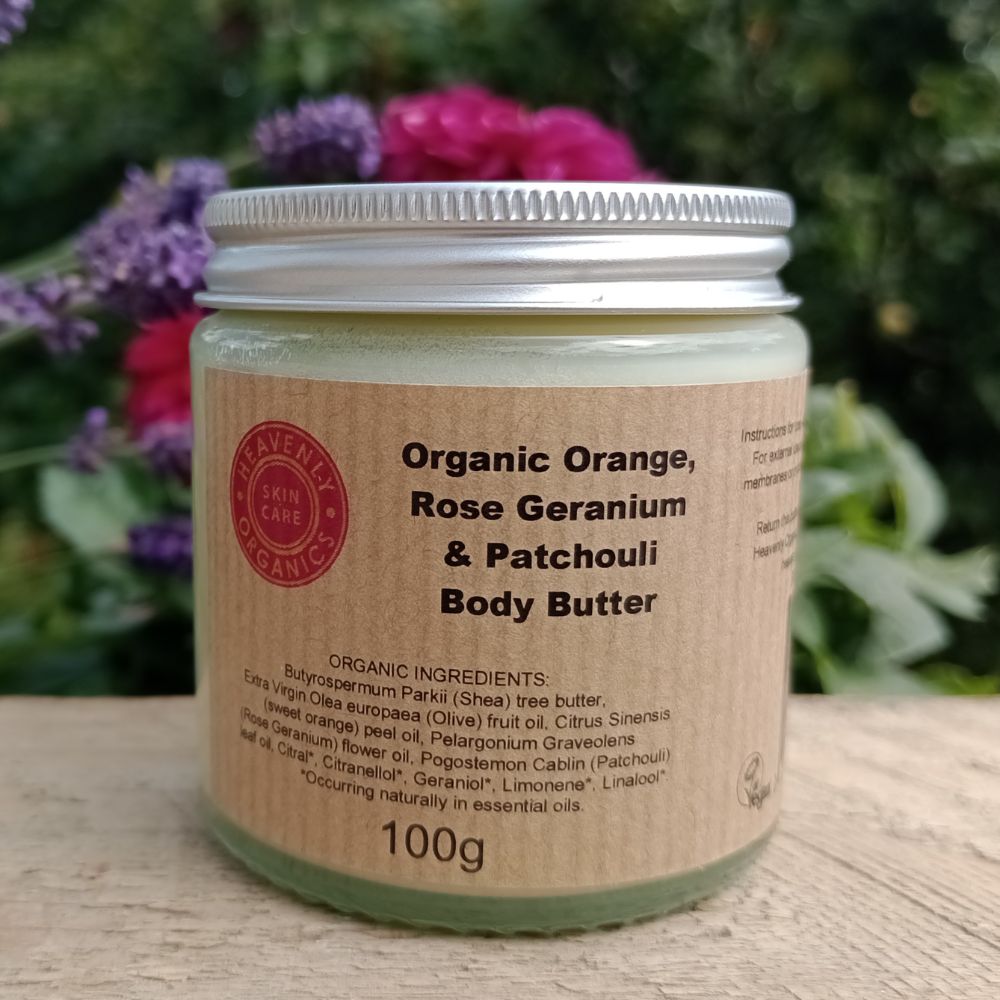 organic body butter by heavenly organics with orange, rose geranium and patchouli in glass jar and metal cap