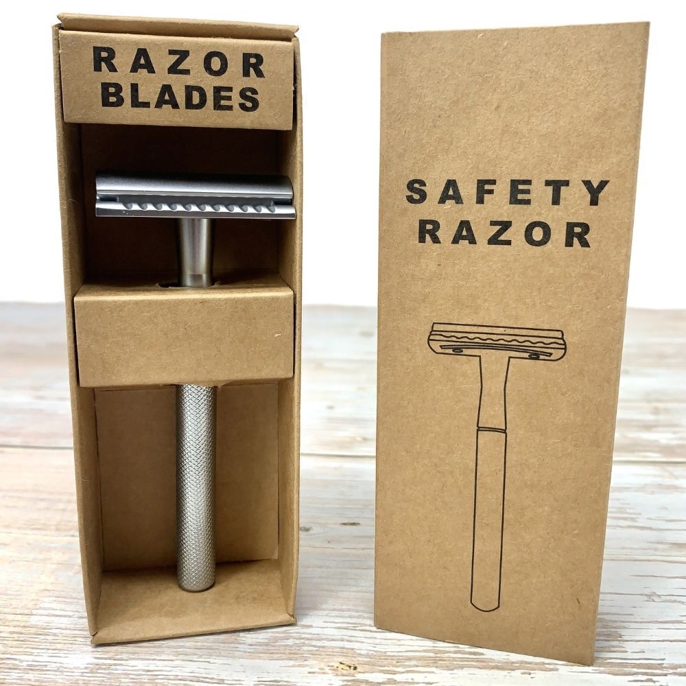 silver stainless steel safety razor with razor blades in brown recyclable cardboard packaging
