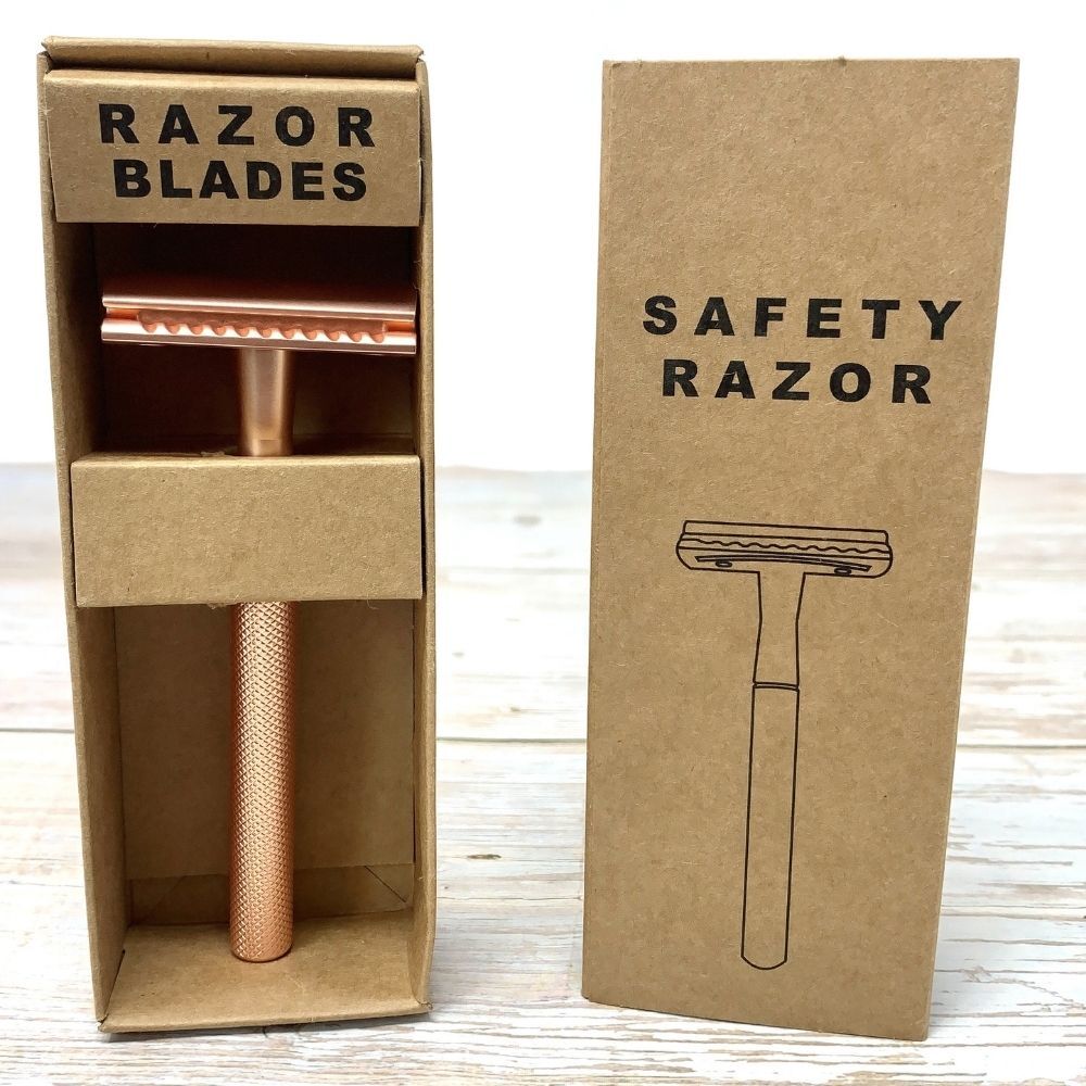 rose gold stainless steel reusable razor with plastic free packaging in cardboard box