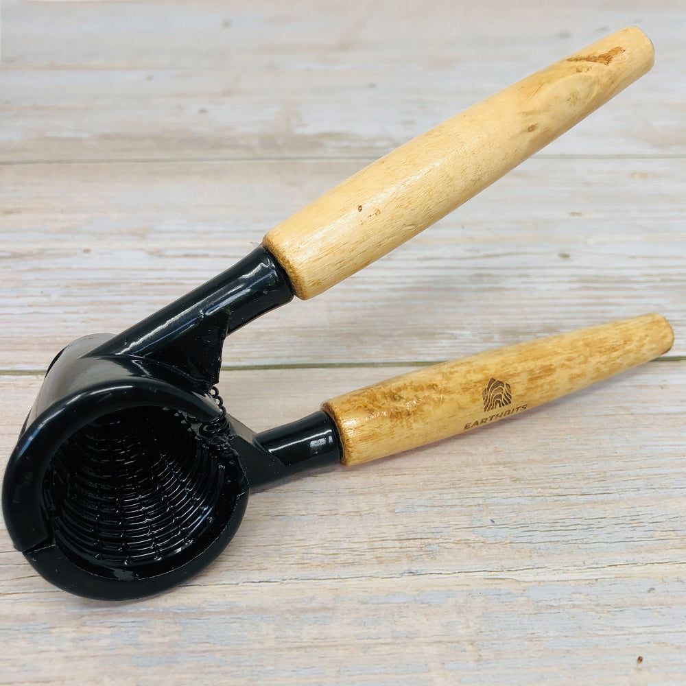 wooden nutcracker with aluminium head and wooden handles