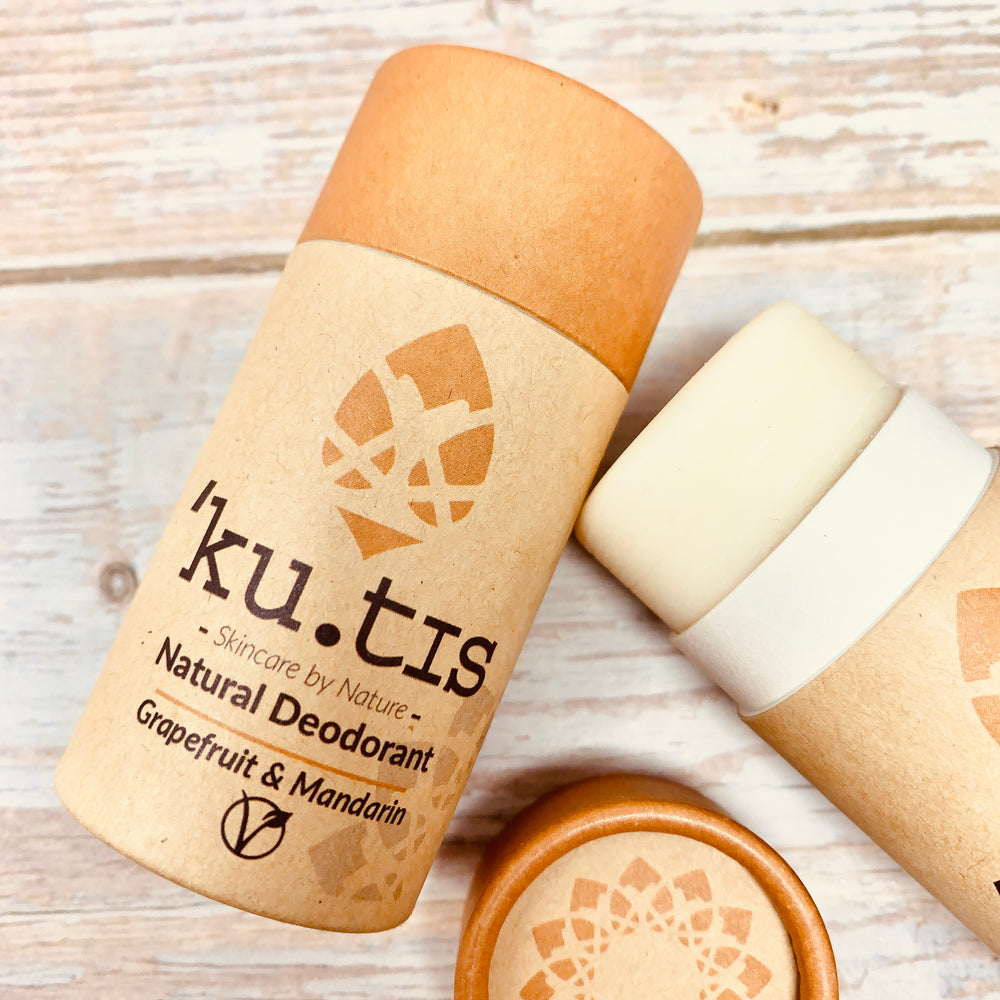 kutis deodorant stick showing packaging and inside product, grapefruit and mandarin deodorant with vegan logo and kutis writing