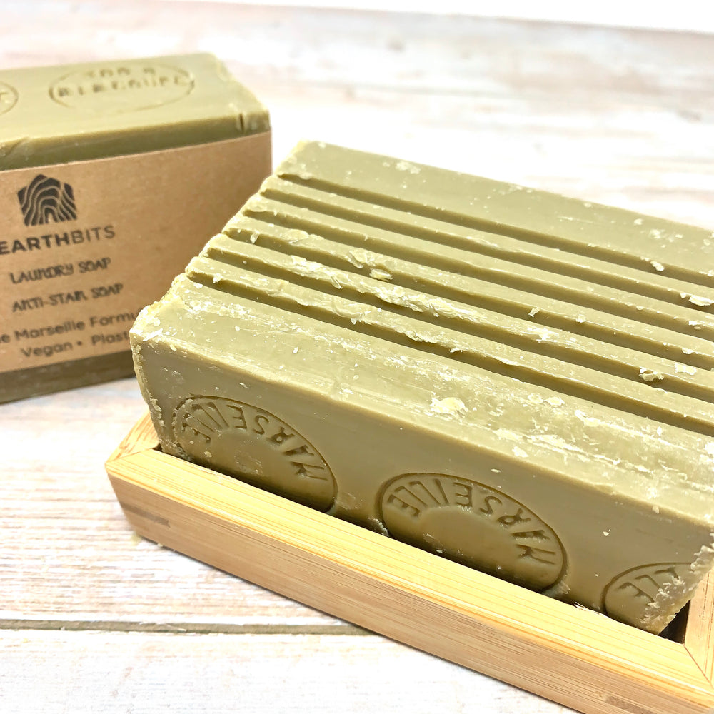 green savon de marseille bar for laundry with earthbits brown paper label and bamboo soap rack