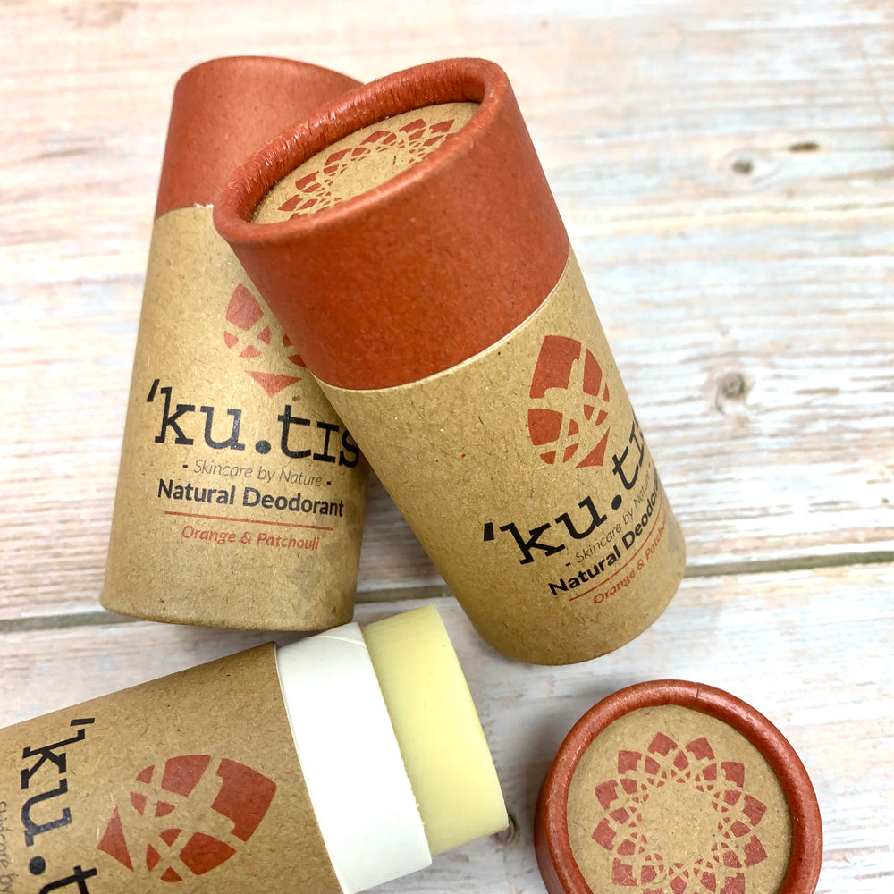 kutis natural vegan deodorant in brown paper tube stick and red cap made with orange and patchouli
