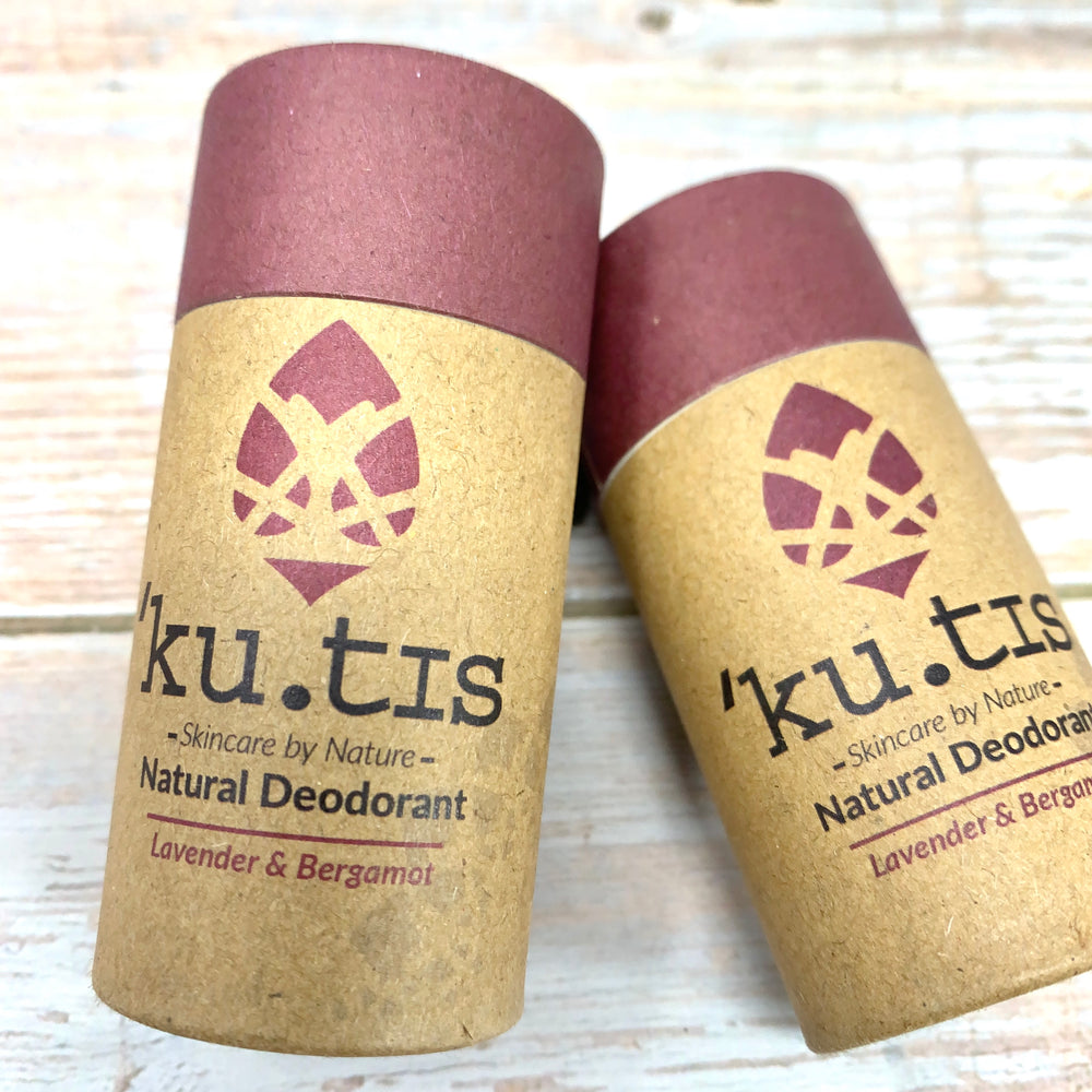 natural deodorant in cardboard push up tube with brown paper and purple label with lavender and bergamot