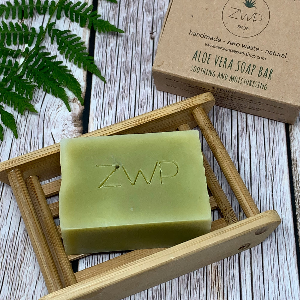 aloe vera green soap bar placed on a handmade bamboo soap dish