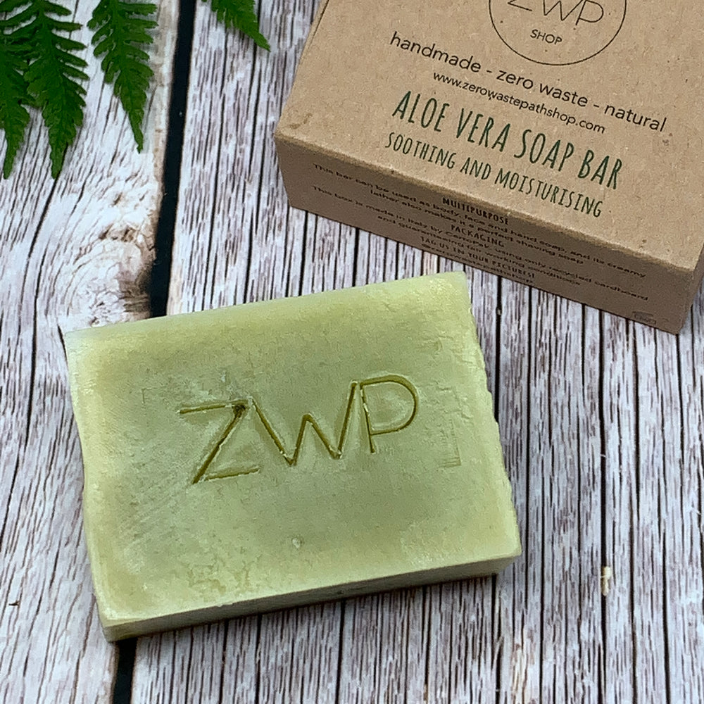 front side of zero waste path aloe vera soap bar for sensitive skin and front of the packaging box
