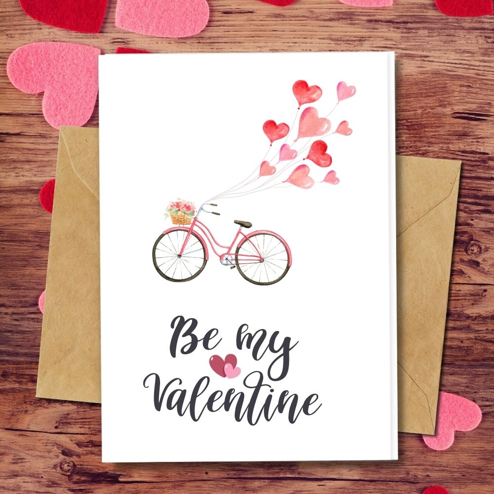 handmade valentines card with a bike and heart balloon design asking to be my valentine cards, seeded paper that are plantable