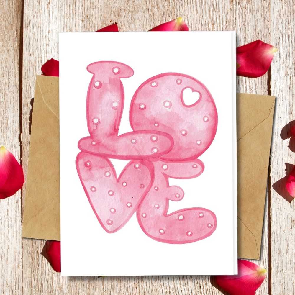 a pink big Love text as a design of a handmade love cards for valentines day, plantable and eco friendly cards