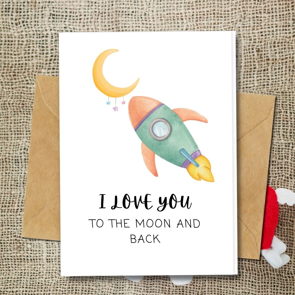 A handmade love cards with a design of moon and rocket saying I love you to the moon and back, eco friendly made of plantable seeded paper and many more