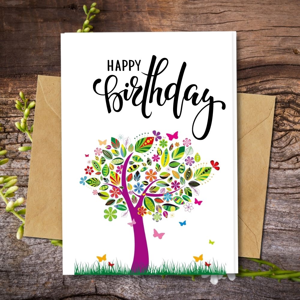 handmade happy birthday card with a colourful designs made of recycled paper, seeded paper coconut paper etc